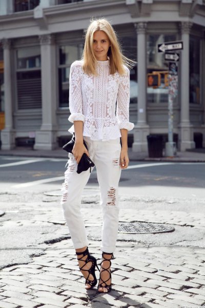 white blouse embroidered with flowers with ripped jeans and strappy heels