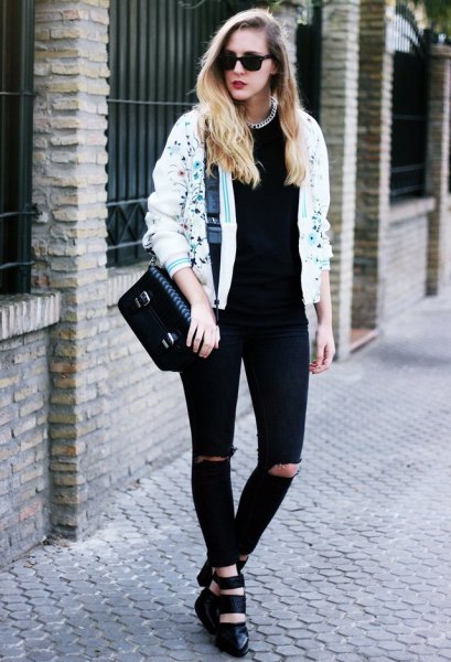 white printed bomber jacket and black jeans