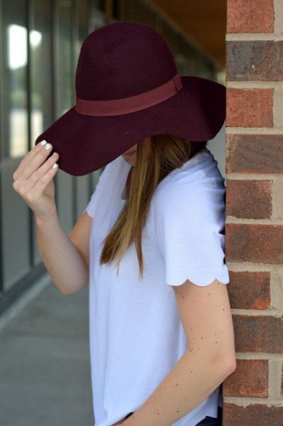 sky blue scalloped shirt with black floppy hat