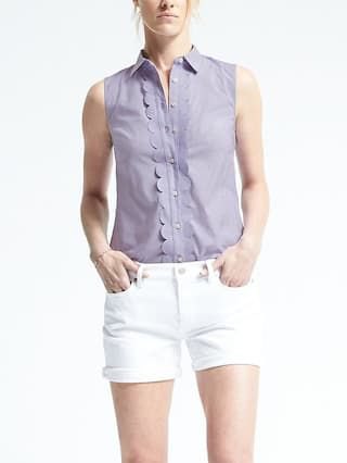 sleeveless teal shirt with white slim denim shorts