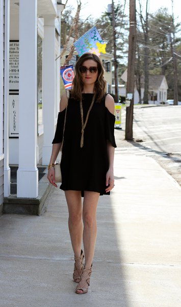 black mini dress with three quarter sleeves and cold shoulder