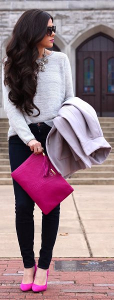 gray sweater with pink clutch