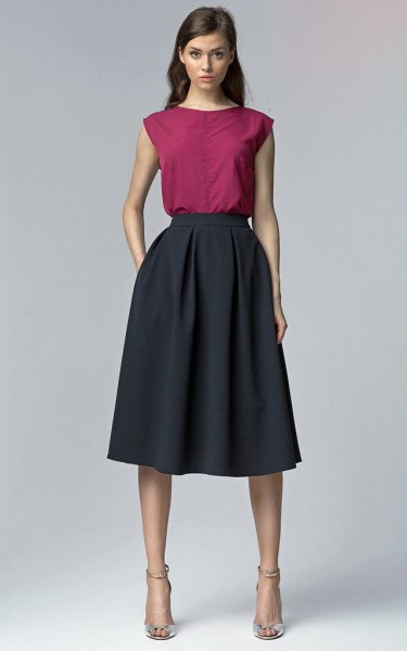 gray sleeveless top with dark blue flared midi skirt