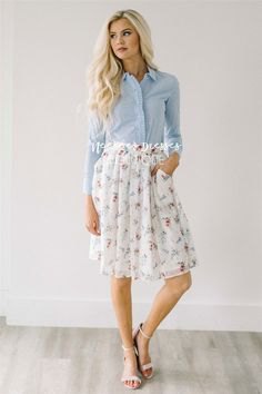 light blue shirt with white pleated floral chiffon skirt with pockets