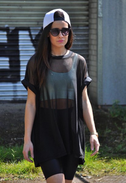 black, semi-transparent tunic blouse with white crop top and mini skirt