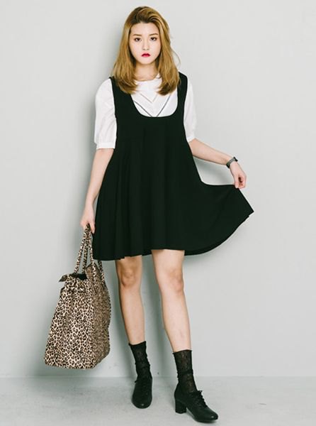 white half sleeve sweater and black stocking mini swing dress