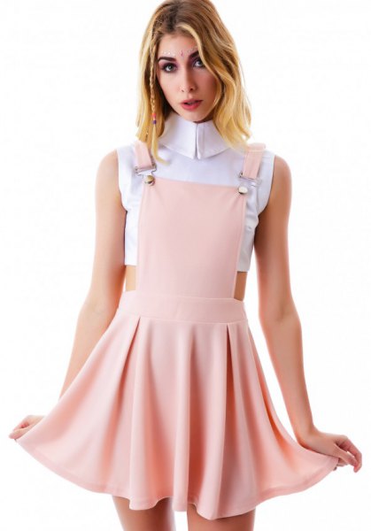 white cropped sleeveless blouse with blush pink mini skater stocking dress