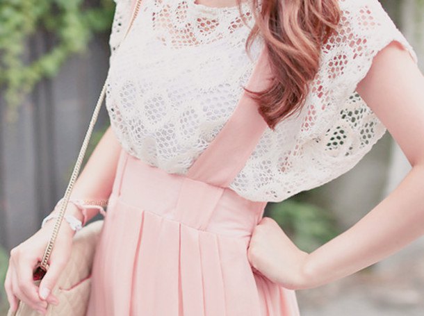white crochet top with cap sleeves and light pink garter dress