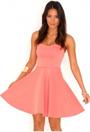 Pink and flare strapless mini dress with gold cuff bracelet