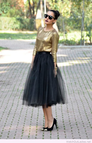 gold blouse with black midi tulle skirt