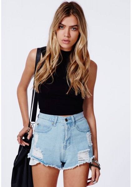 black sleeveless cropped sweater with high waisted shorts