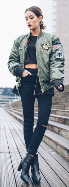 gray patch pilot jacket with black cropped t-shirt and leather boots
