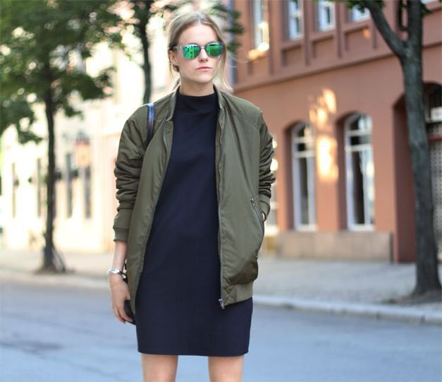 green pilot jacket with black t-shirt dress