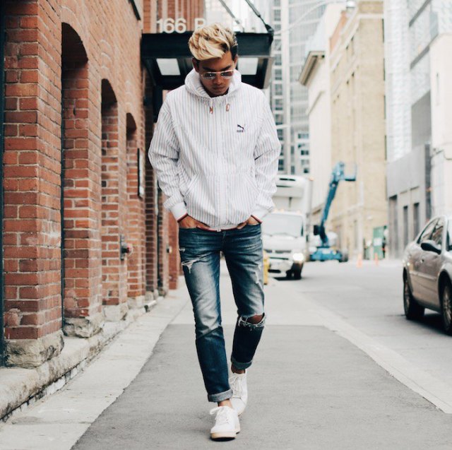 white windbreaker with blue washed straight leg jeans
