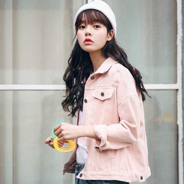 Light pink denim jacket with blue jeans and white knit hat