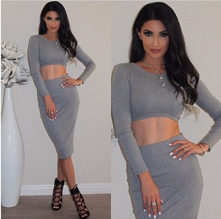 gray two-piece, figure-hugging mini dress with black strappy heels