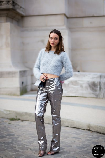 Light blue cropped knit sweater with silver trousers and sandals