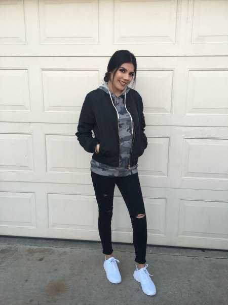 gray graphic hoodie with black Nike windbreaker and tights