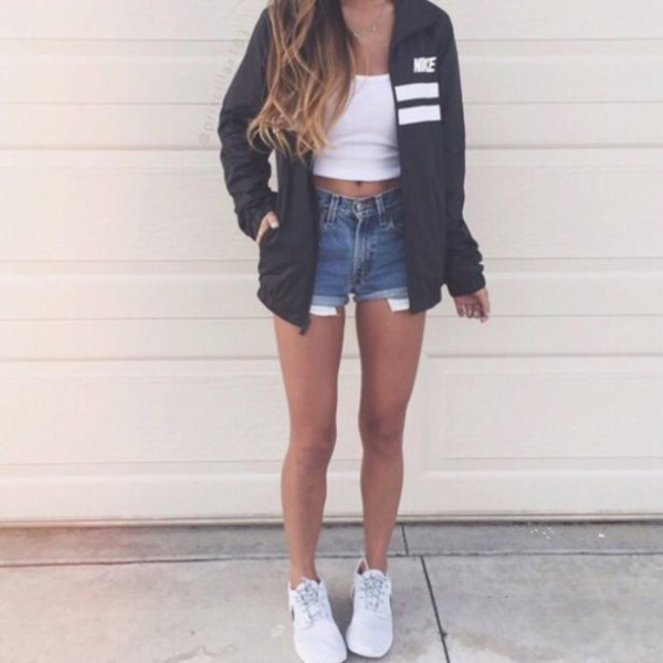black oversized windbreaker with white crop top and blue denim shorts
