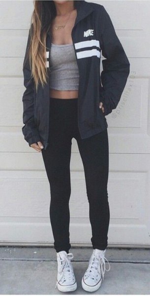 black windbreaker with gray scoop tank top and white canvas sneakers