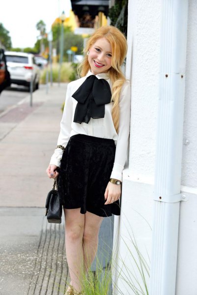 white chiffon bow tie with black mini skirt