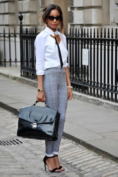 white and black blouse in front with plaid chinos