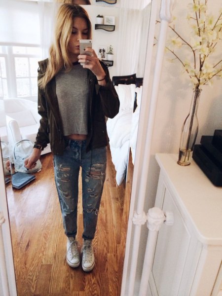 gray short t-shirt with black leather jacket and ripped jeans with cuffs