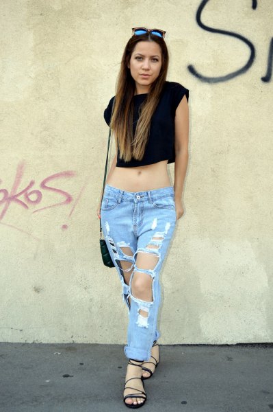 black sleeveless cropped t-shirt with super ripped boyfriend jeans