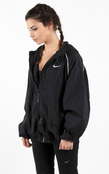 black windbreaker with gray mock-neck sweater and skinny jeans