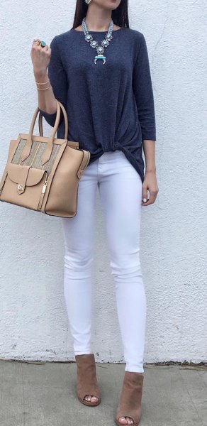 dark gray three-quarter top with white jeans and open toe boots