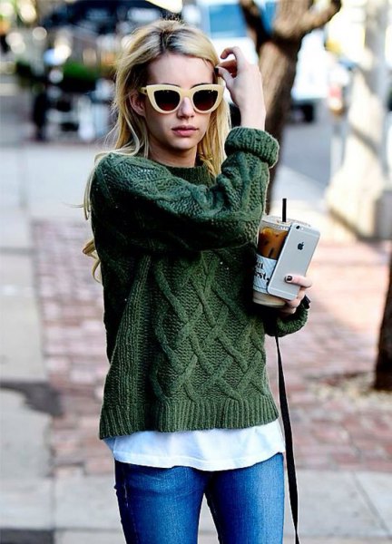 green cable knit sweater and white t-jeans