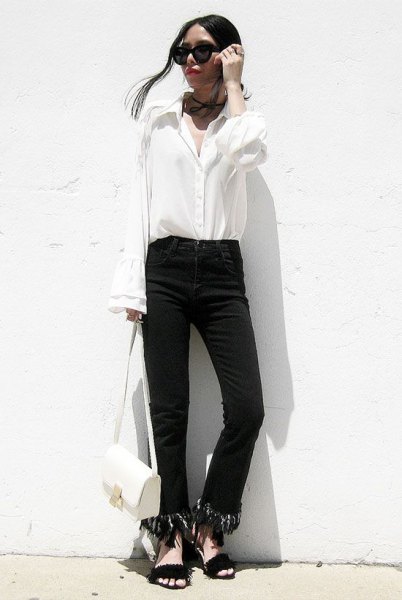 black fringed-hem jeans and white bell-sleeve shirt