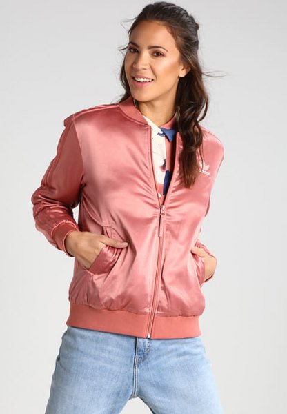 pink sports jacket with light blue boyfriend jeans