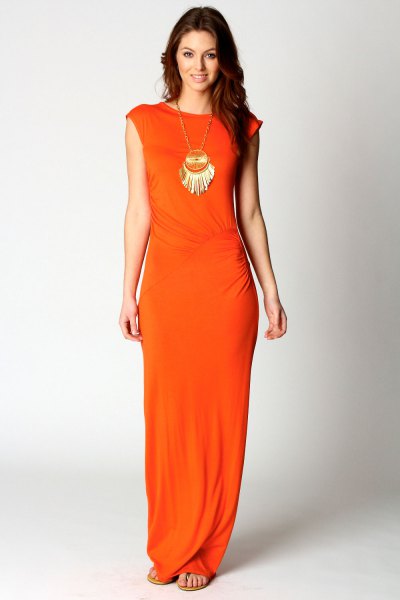 Orange dress with cap sleeves and a boho statement necklace