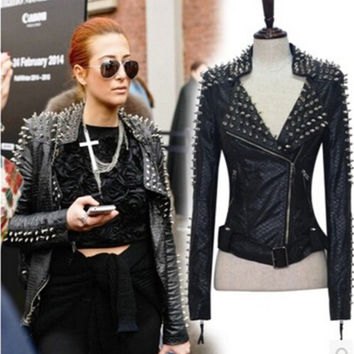 Spiked leather jacket, crop top and high waist black mini skirt