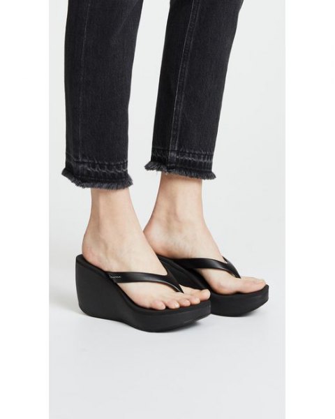 black slim fit jeans with matching flip flops