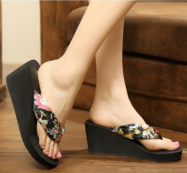 Flip flops with black and blush pink floral motifs, heels and mini dress