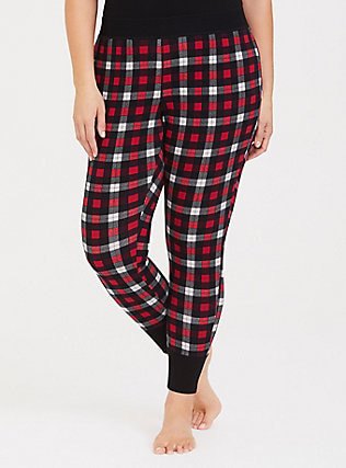 black tank top with red and white plaid pajama bottoms with tapered legs
