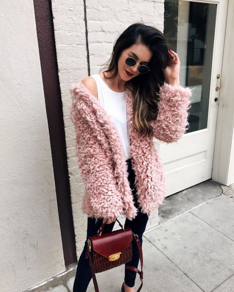 pink fuzzy sweater cardigan with white vest top and black jeans
