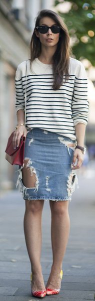white and black striped knit sweater with a round neckline and a light blue denim mini skirt