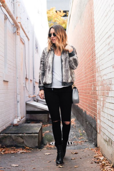 gray heather fur bomber jacket with black ripped slim fit jeans