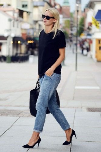 black t-shirt with blue cropped, loose-fitting jeans