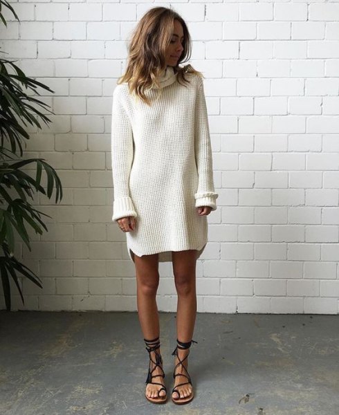 white ribbed sweater dress with black flat gladiator sandals