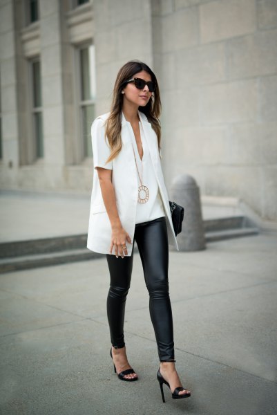 white short sleeve shirt with black leggings and heels