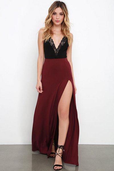 Black lace deep V-neck top paired with a high-waisted maroon maxi skirt