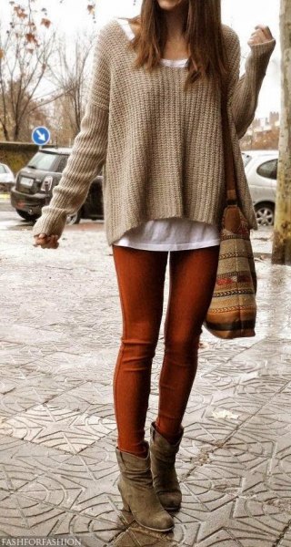 Coffee brown knit slightly flared sweater over a white tank top