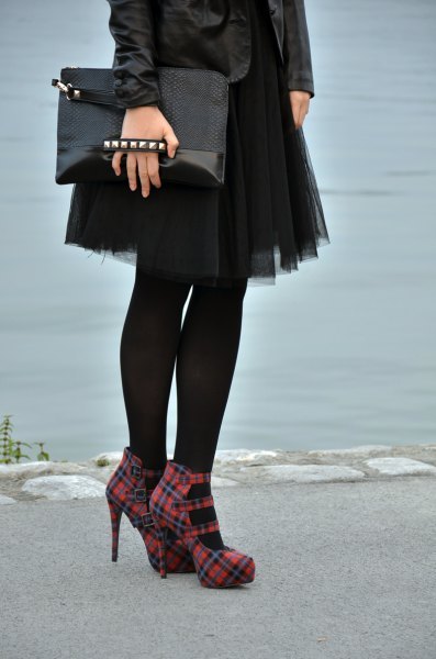 black leather jacket with mini tulle skirt and red checked heels