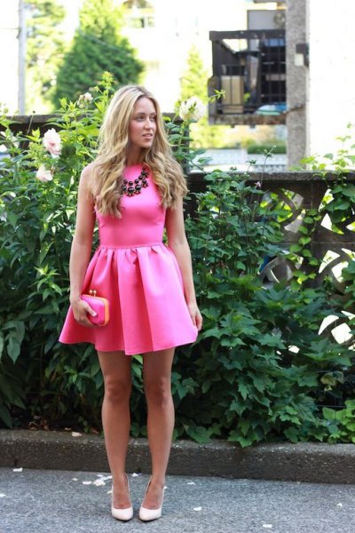 Blush pink sleeveless mini skater dress with statement chain