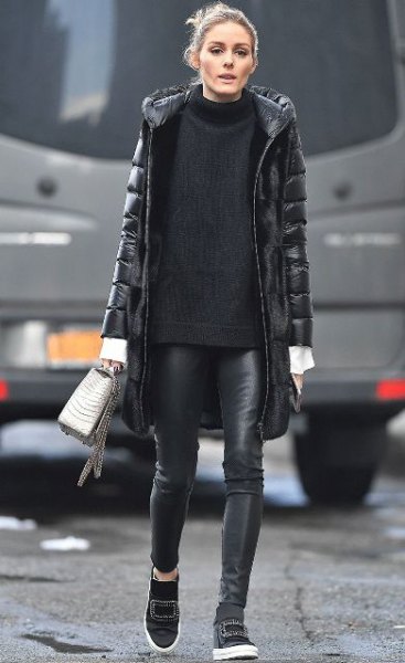 black long puffer coat with comfortable turtleneck sweater and leather leggings