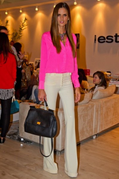 pink chiffon blouse with buttons and light yellow flared pants
